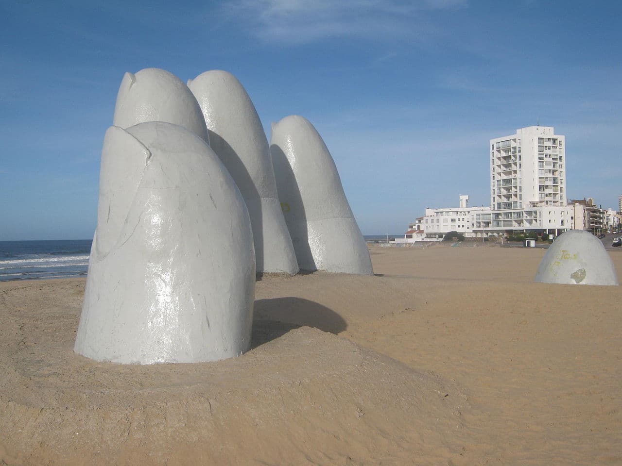 La Mano de Punta del Este - a giant sculpture of five fingers rising out of the sand on the beach